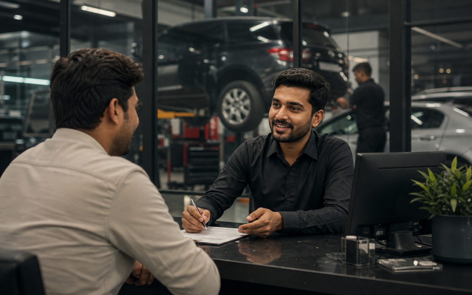 Indian customer support executive assisting a customer in a service center